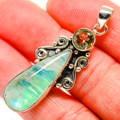 Sterling silver pendant with green opal teardrop and round green crystal, swirl settings