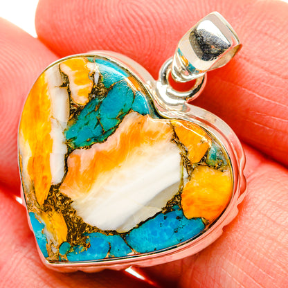 Sterling silver heart pendant with turquoise and orange stone inlay close-up