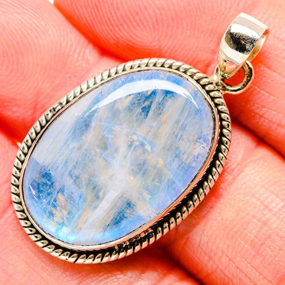 Blue rainbow moonstone pendant in sterling silver teardrop setting with bail loop