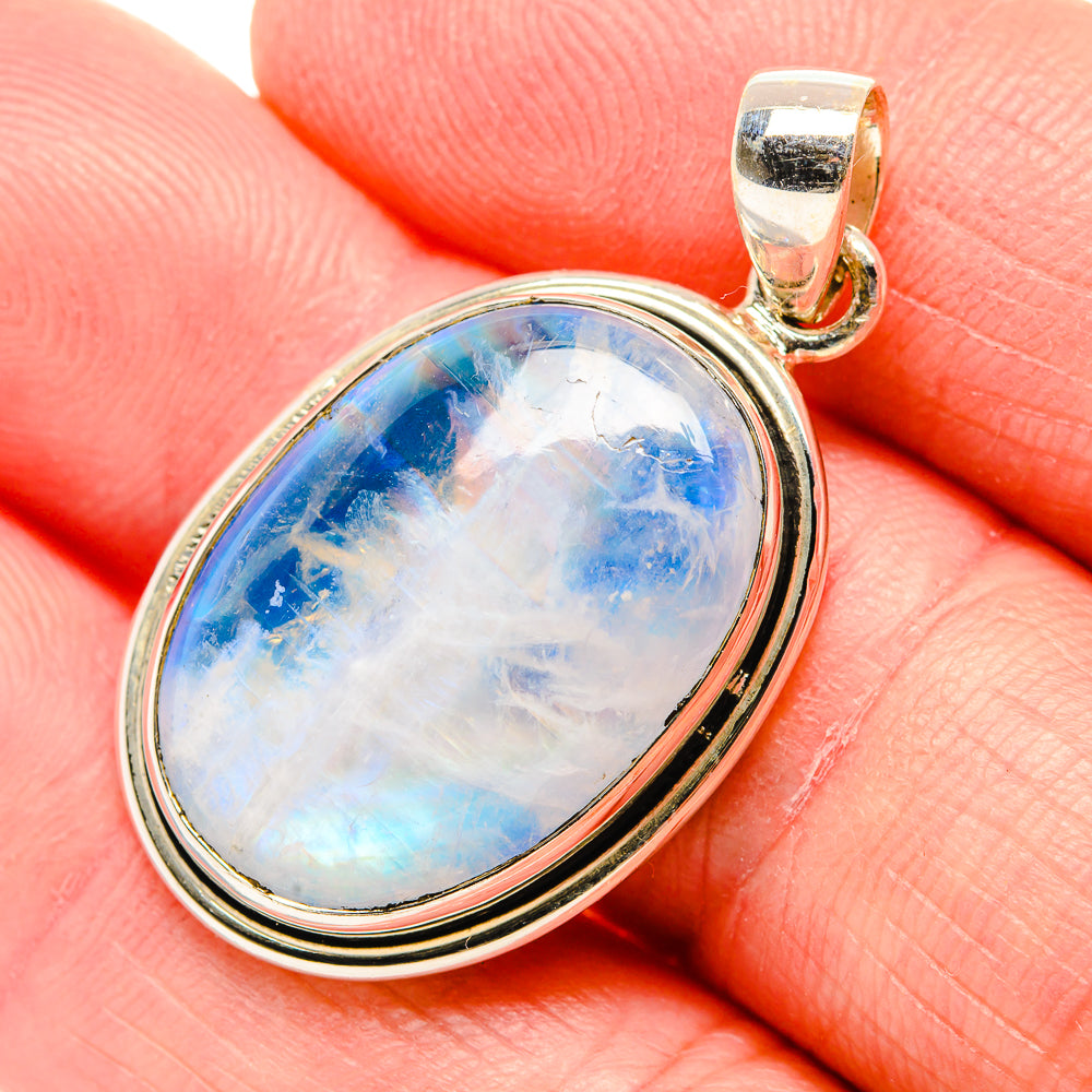 Oval rainbow moonstone pendant in 925 sterling silver bezel with bail