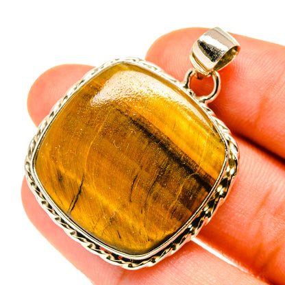 Tiger eye pendant in 925 sterling silver bezel with loop bail, golden-brown stone