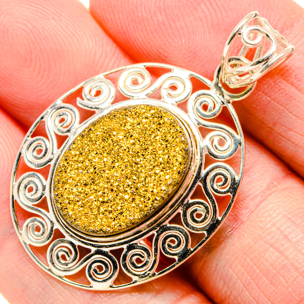 Silver filigree pendant with round gold druzy cabochon and decorative swirl border