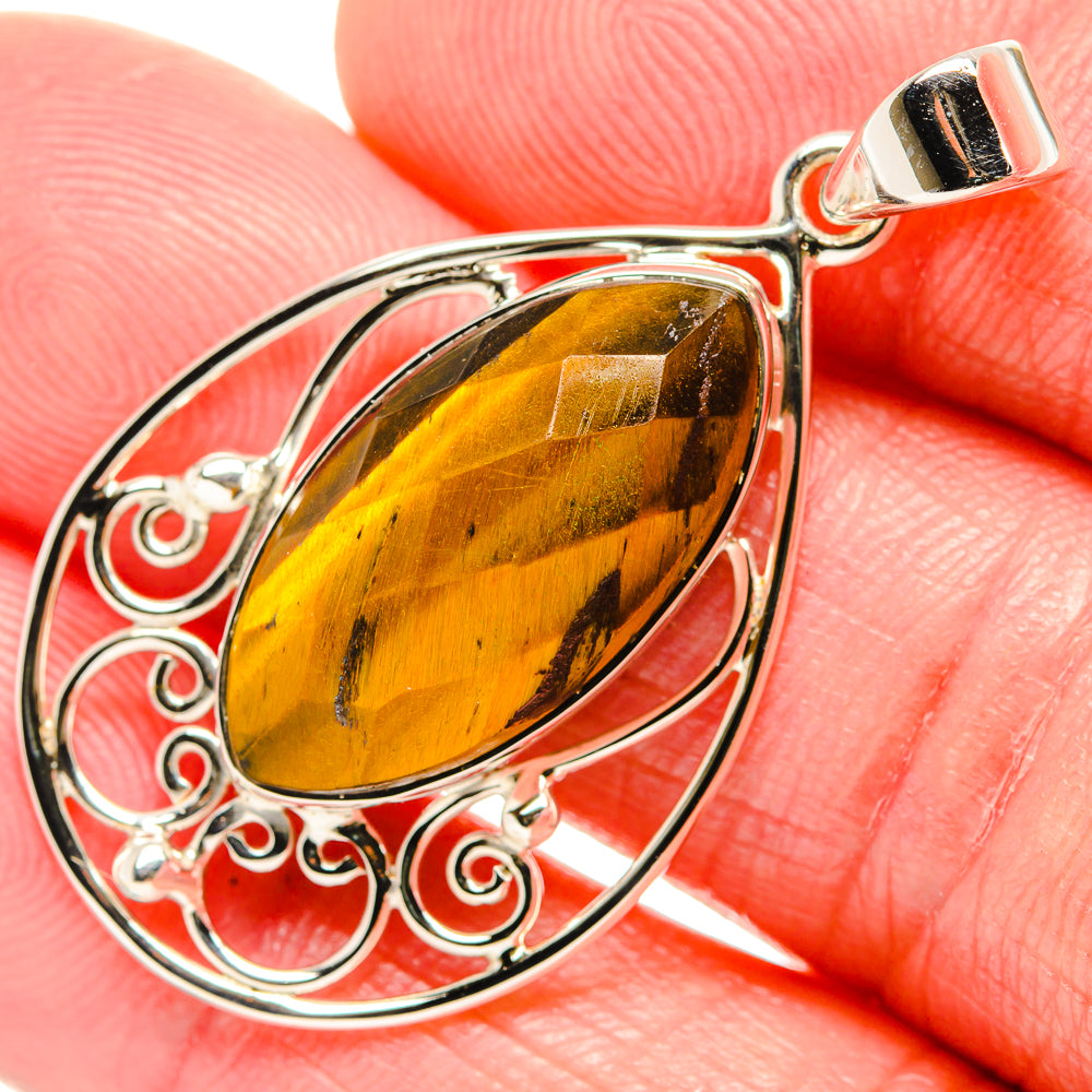 Sterling silver tiger eye teardrop pendant with engraved scrollwork and square-top bail