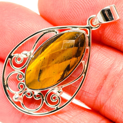 Sterling silver tiger eye teardrop pendant with engraved scrollwork and square-top bail