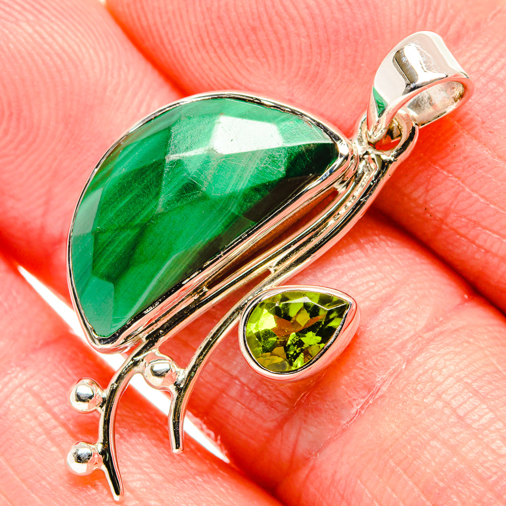 Green malachite teardrop pendant with peridot oval stone and sterling silver setting