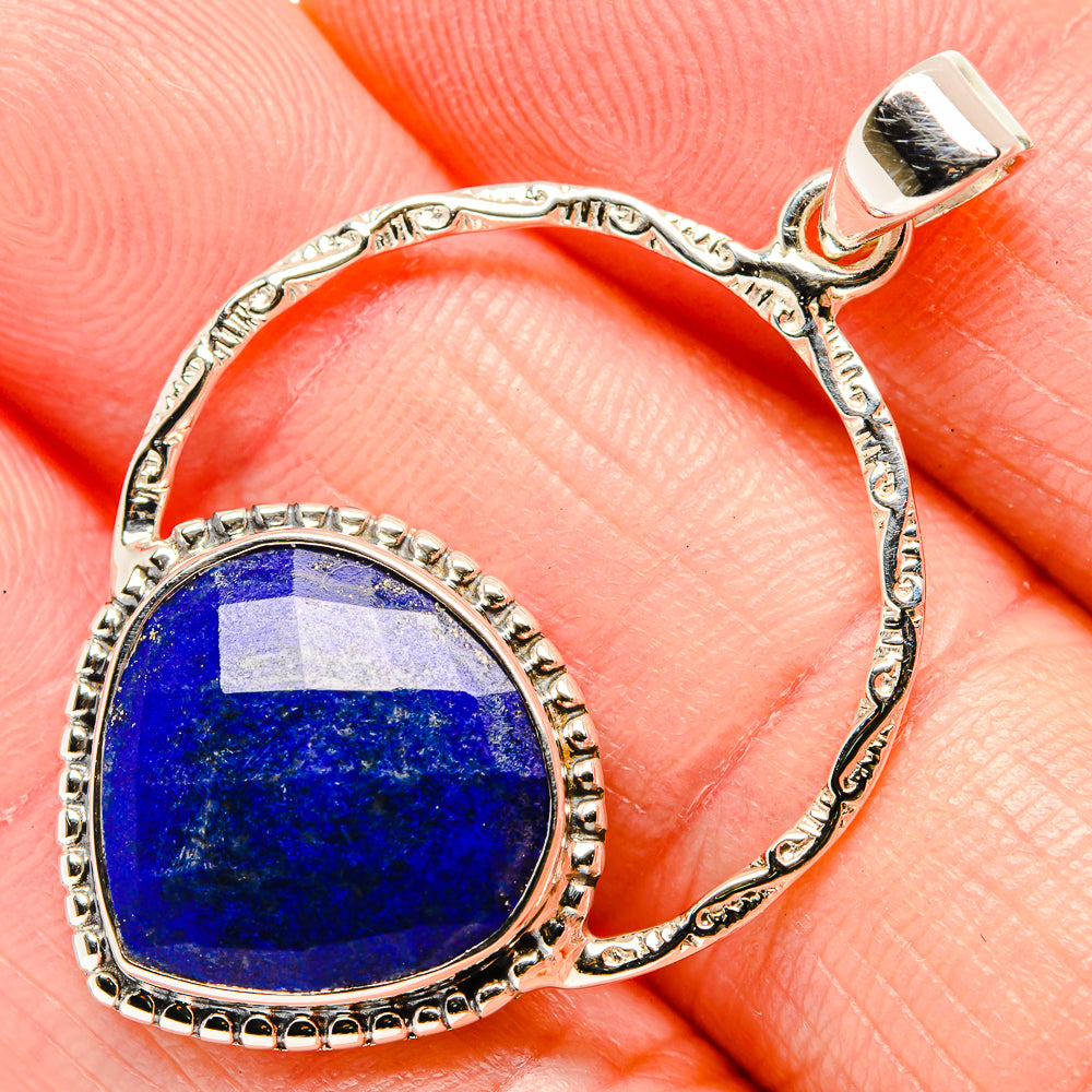 Close-up oval lapis lazuli pendant bezel set in 925 sterling silver bail