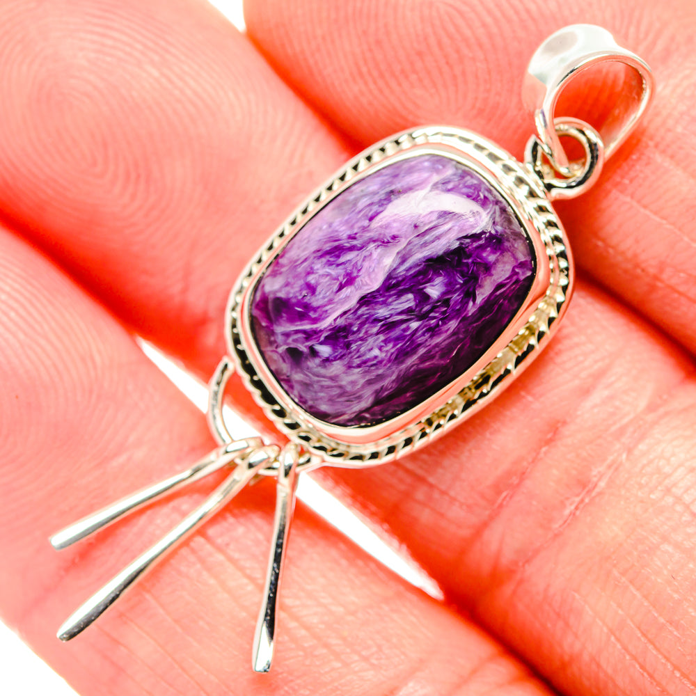 Oval purple charoite gemstone pendant, sterling silver bezel with textured edge and bail