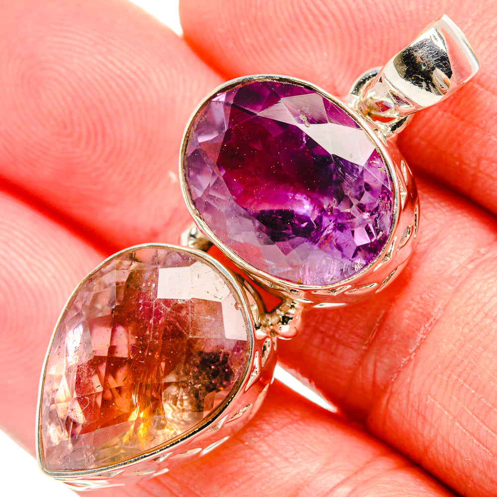 Sterling silver pendant bail with faceted purple gemstone and amber companion stone