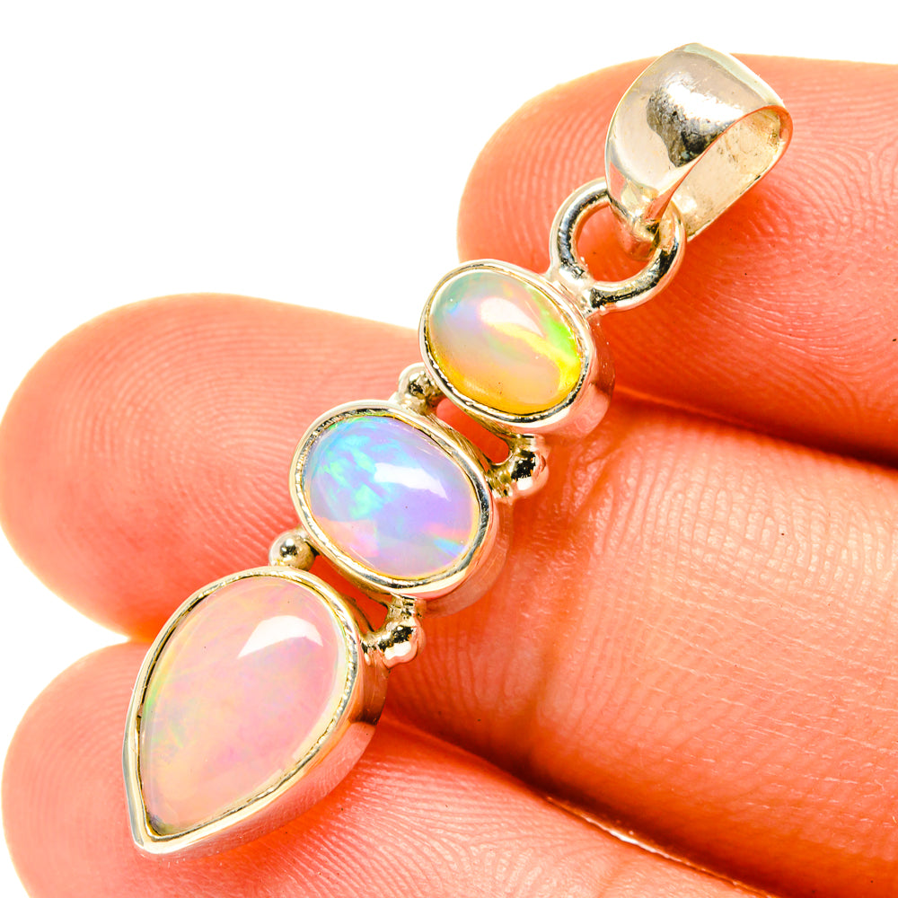 Opal pendant with oval iridescent stones and silver bail, sterling silver setting