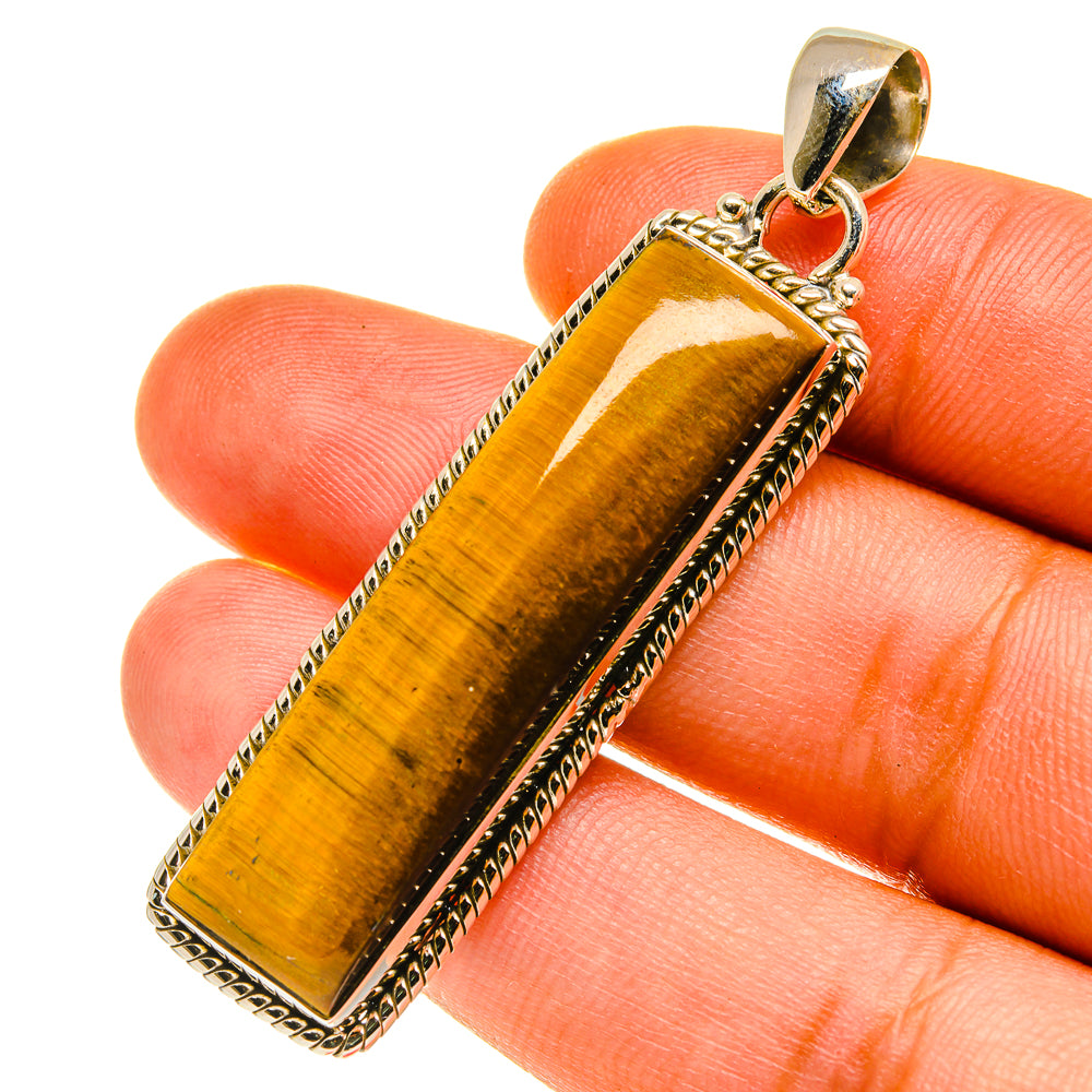 Tiger eye pendant with sterling silver bail, rectangular amber stone on setting