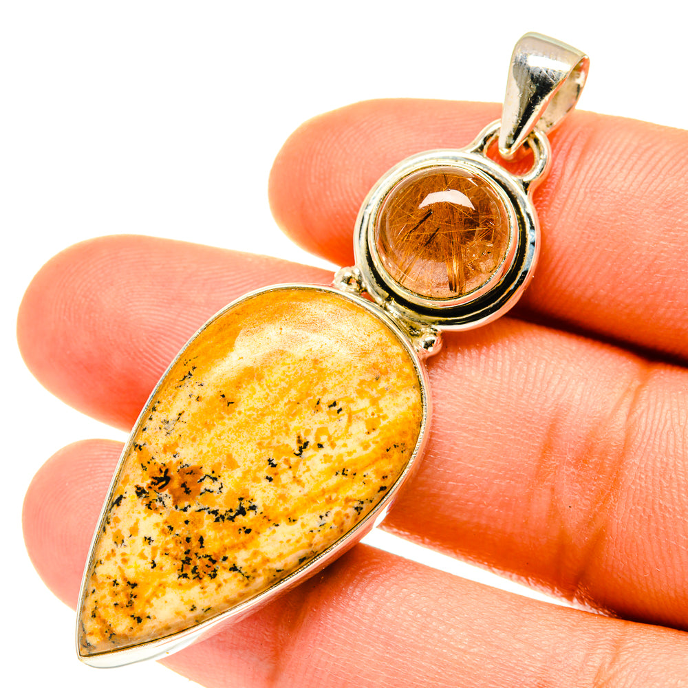 Teardrop picture jasper and round rutilated quartz pendant in polished silver setting
