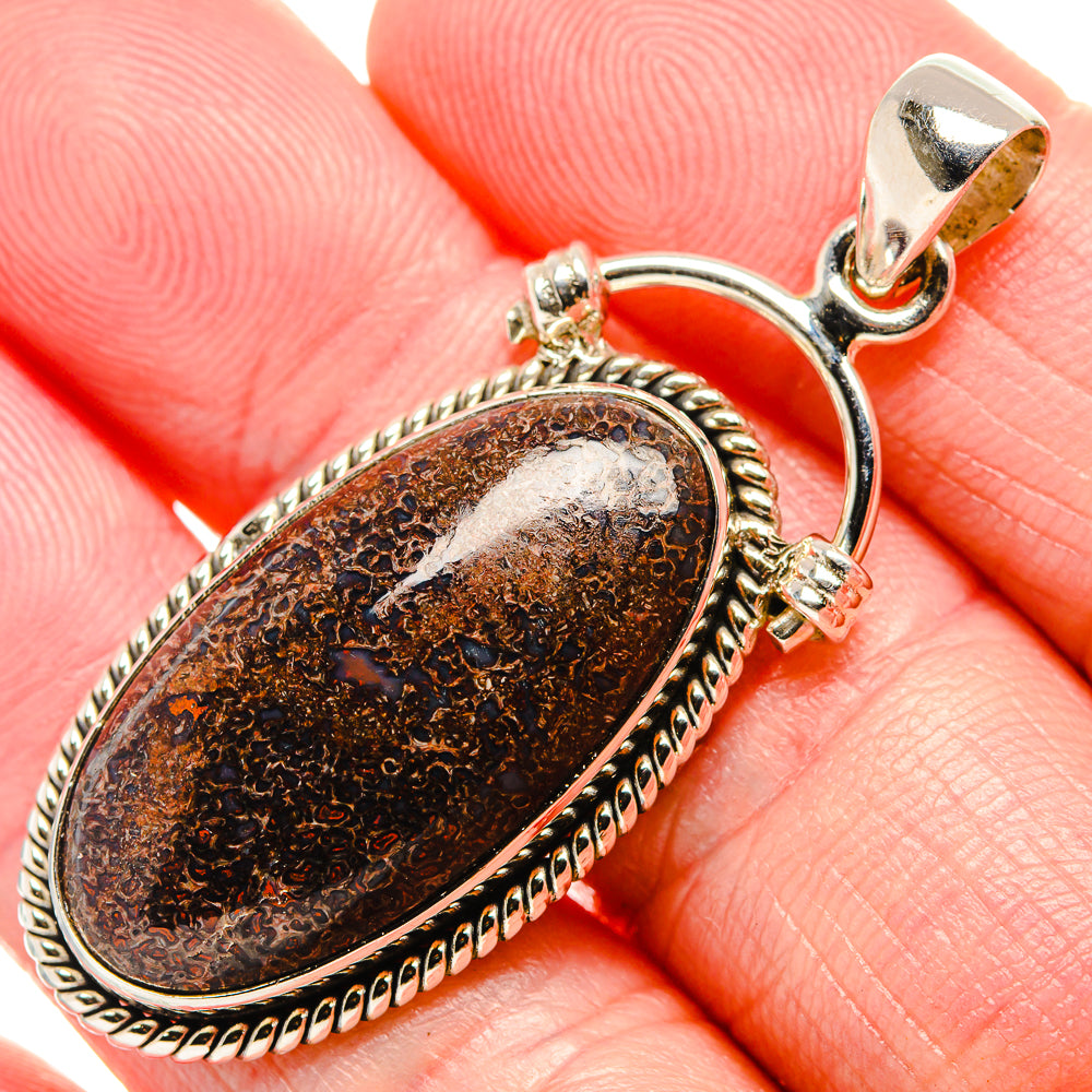 Oval dinosaur bone pendant, 925 sterling silver with rope border and round bail