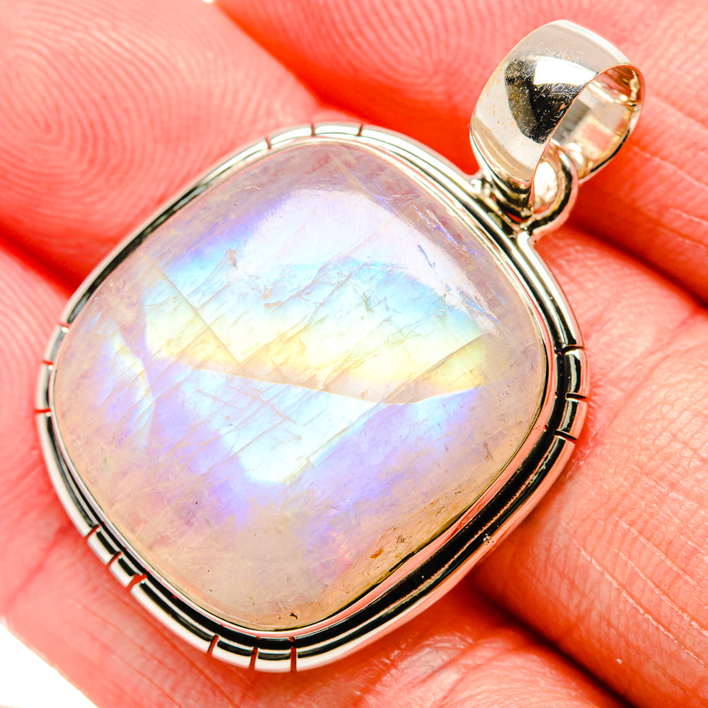 Oval moonstone pendant in polished 925 silver frame, rainbow shimmer on cabochon.
