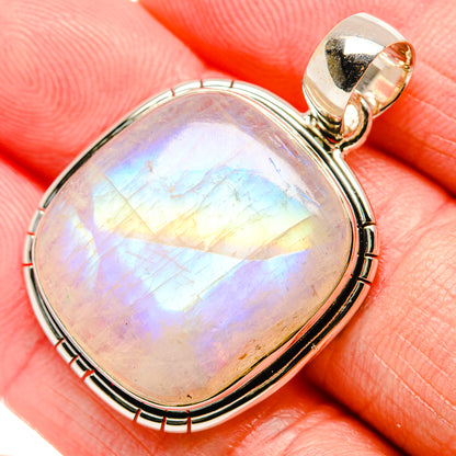 Oval moonstone pendant in polished 925 silver frame, rainbow shimmer on cabochon.