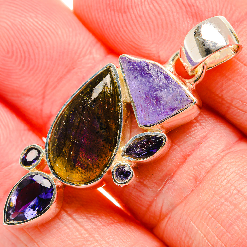 Sterling silver pendant detail: iridescent labradorite teardrop with purple tanzanite stones