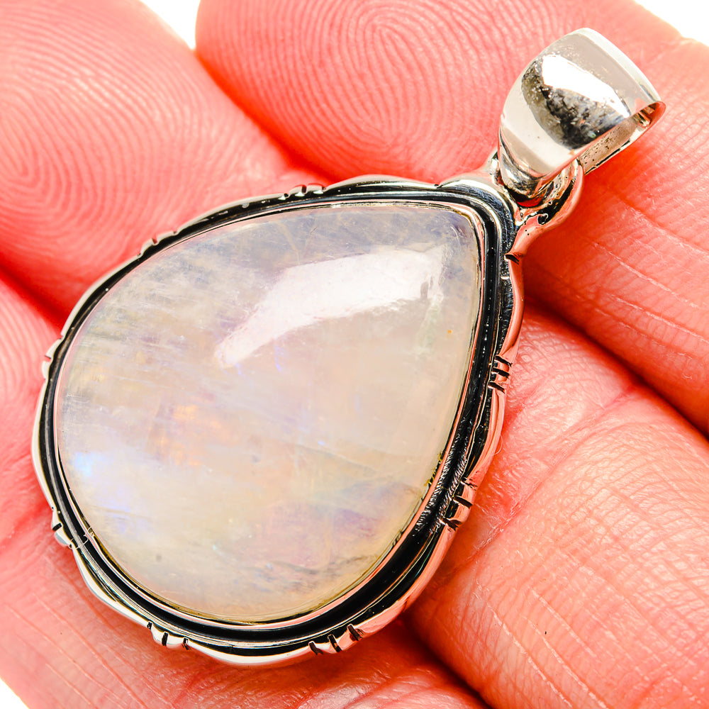 Teardrop moonstone pendant with silver bezel and bail, iridescent opalescent glow