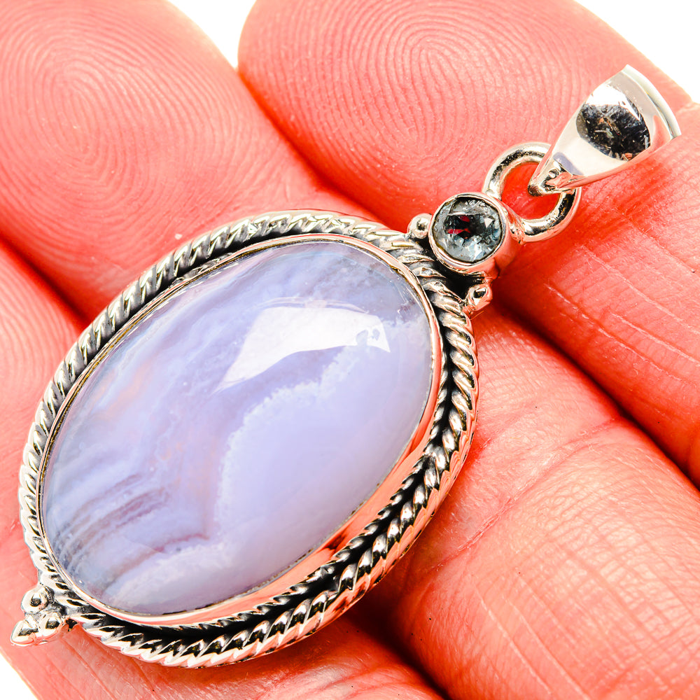 Sterling silver oval blue gemstone pendant with rope bezel and blue top accents