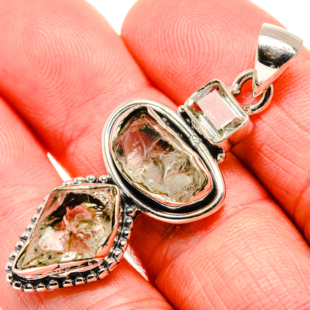 Sterling silver pendant close-up with rough green amethyst oval bezel and side teardrop