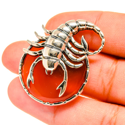 Scorpion pendant, 925 sterling silver with orange oval carnelian stone and claw detail
