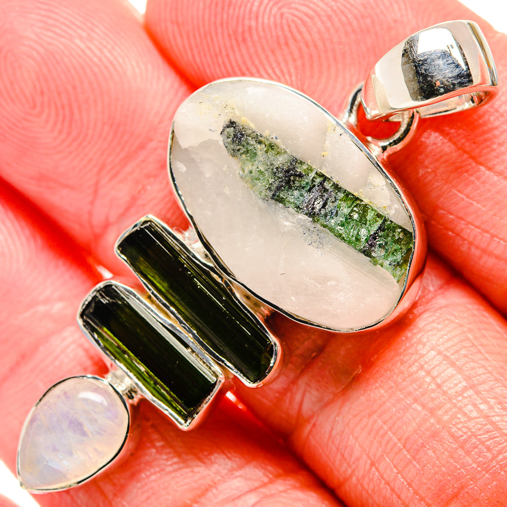 Sterling silver pendant with oval white quartz and green tourmaline, oval bail