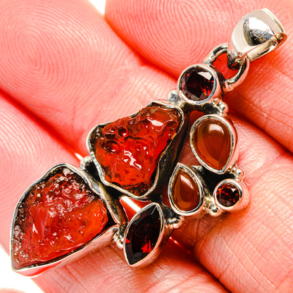 Sterling silver pendant with rough red garnet and dark marquise stones, top bail loop