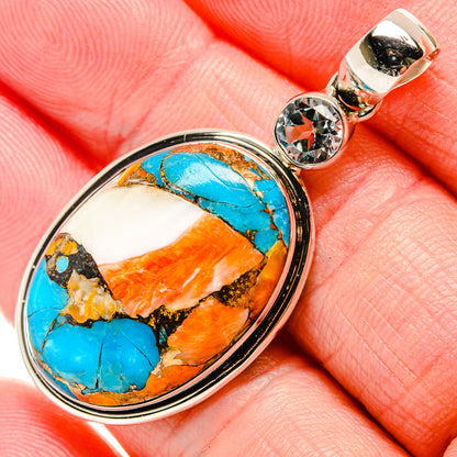 Oval spiny oyster turquoise and orange gemstone pendant in silver with round top clear stone