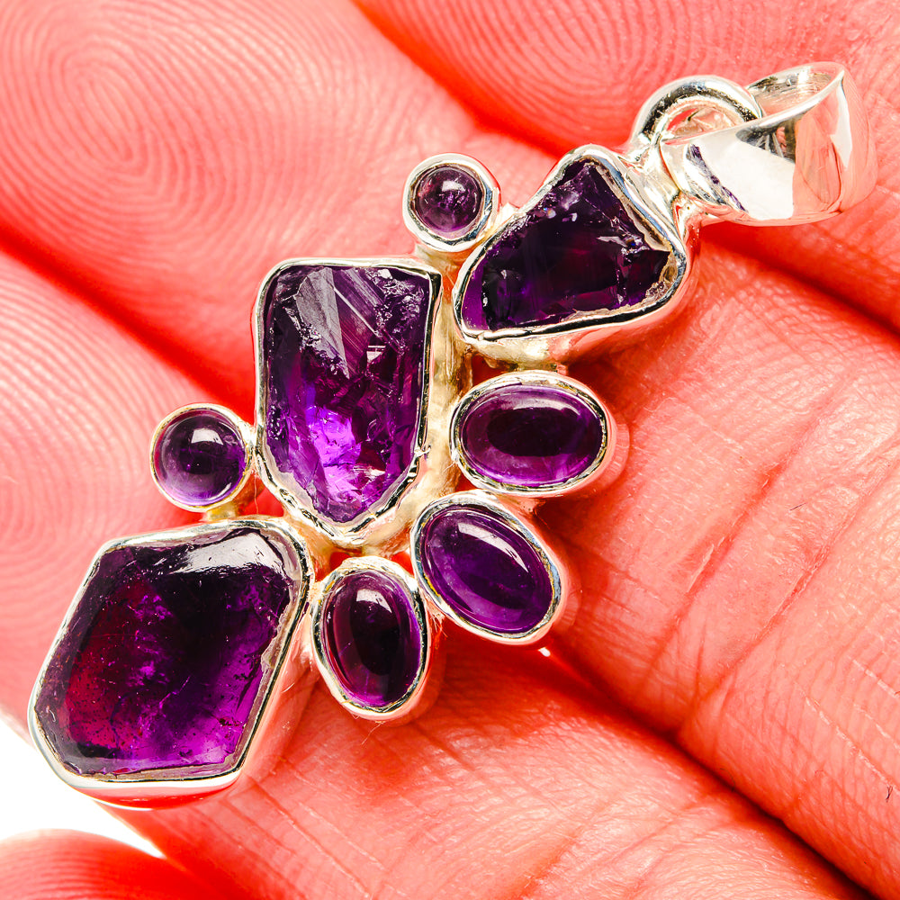 Rough amethyst pendant detail in 925 sterling silver with purple rough and round stones