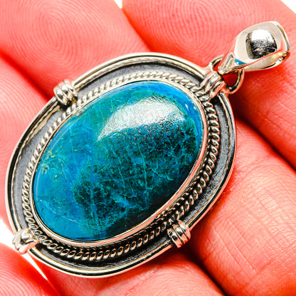 Close-up oval chrysocolla pendant in 925 sterling silver bezel and bail