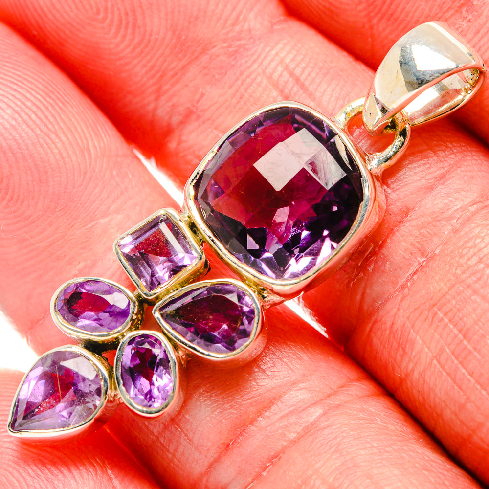 Sterling silver faceted amethyst pendant with oval center stone and leaf accents