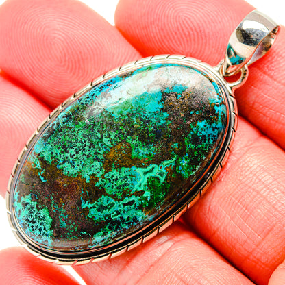 Sterling silver oval shattuckite pendant with turquoise, green, and brown marbled stone