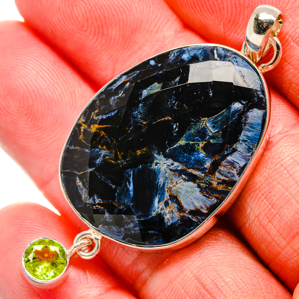 Oval pietersite pendant with blue-black stone and round peridot accent, 925 silver setting
