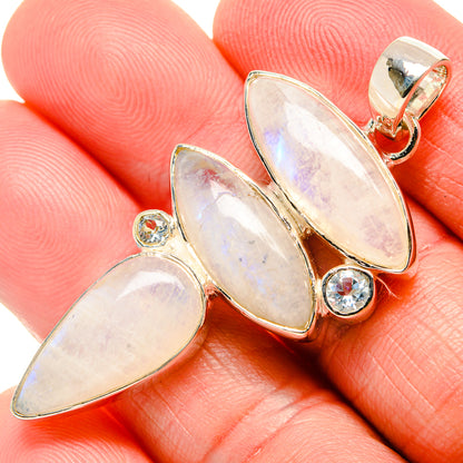 Opalescent oval gemstone pendant in 925 sterling silver with round blue accents