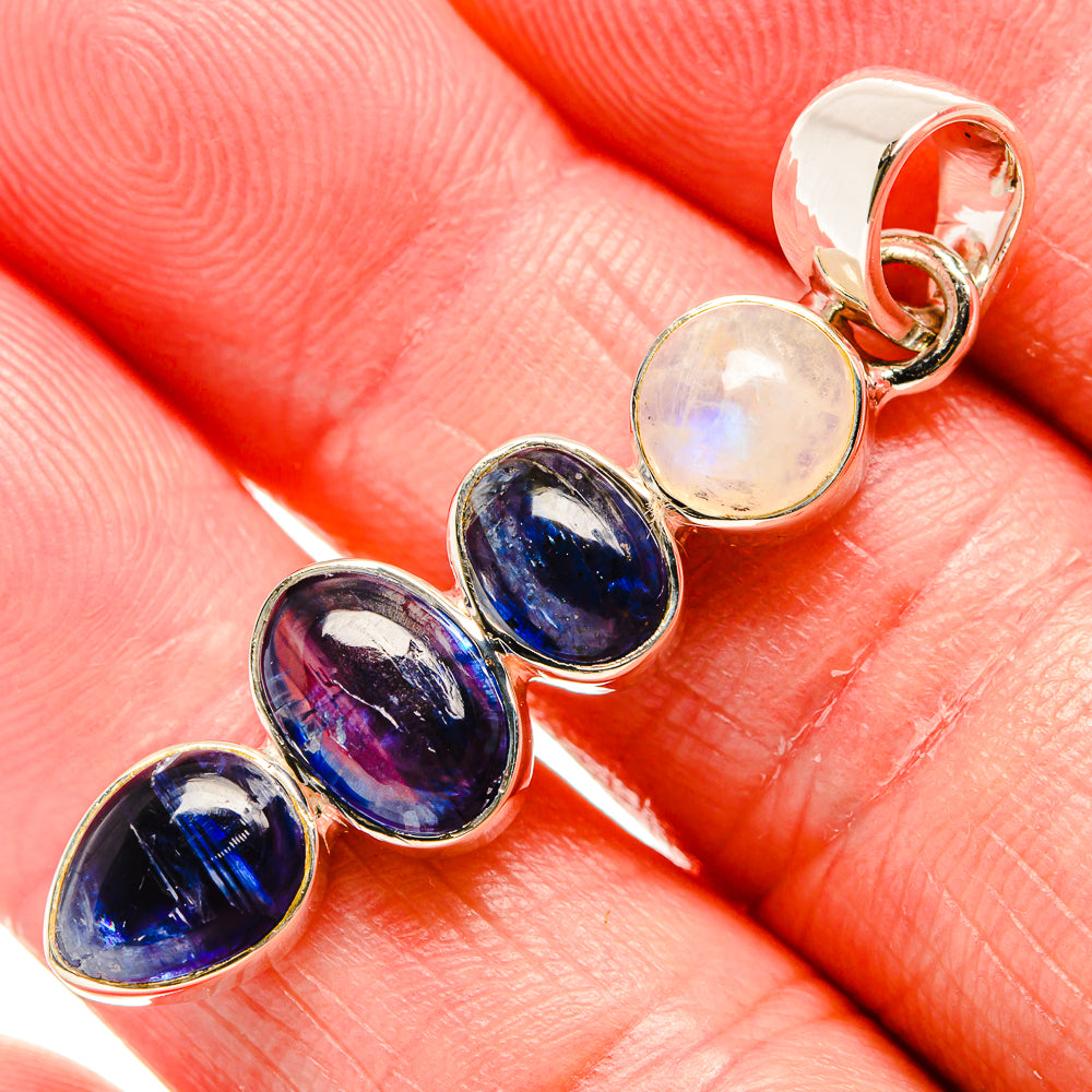 Sterling silver pendant with oval rainbow moonstone and three dark blue gemstone ovals