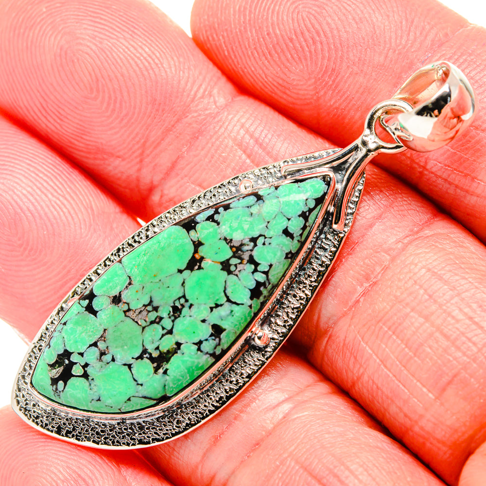 Sterling silver teardrop turquoise pendant with green stone inlay and textured bezel