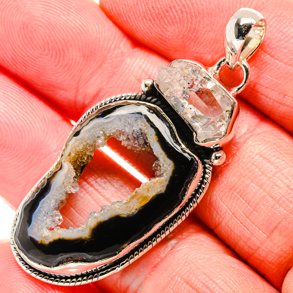 Geode druzy pendant close-up with clear crystal top and black stone bezel