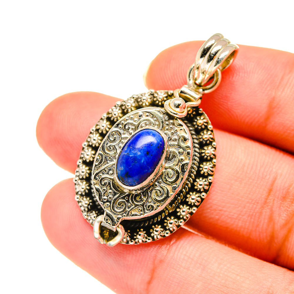Sterling silver lapis lazuli pendant, oval blue stone with ornate bezel