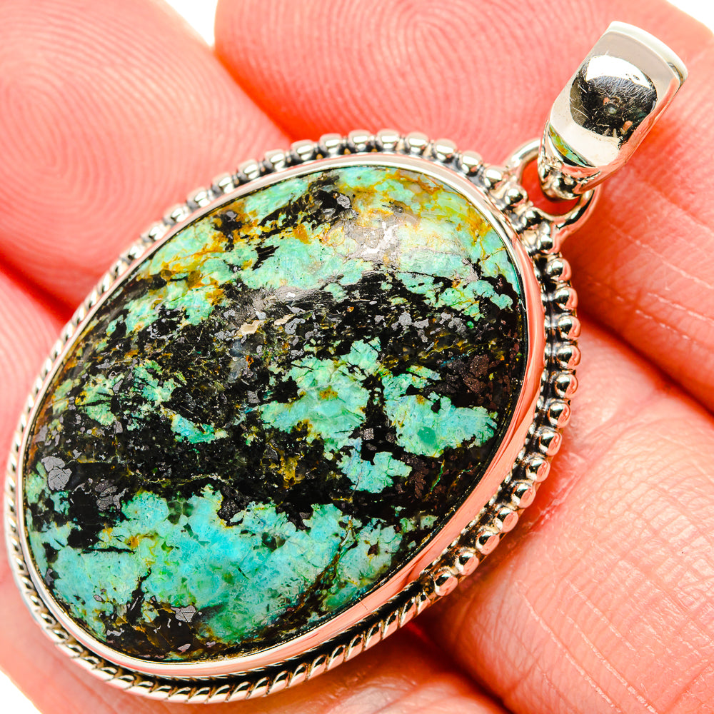 Close-up oval turquoise stone pendant in 925 sterling silver with bail
