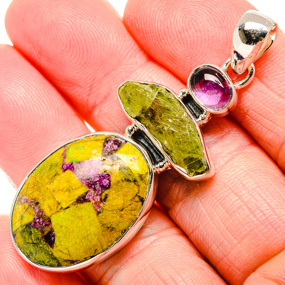 Sterling silver pendant with yellow-green oval and pink gemstone accents