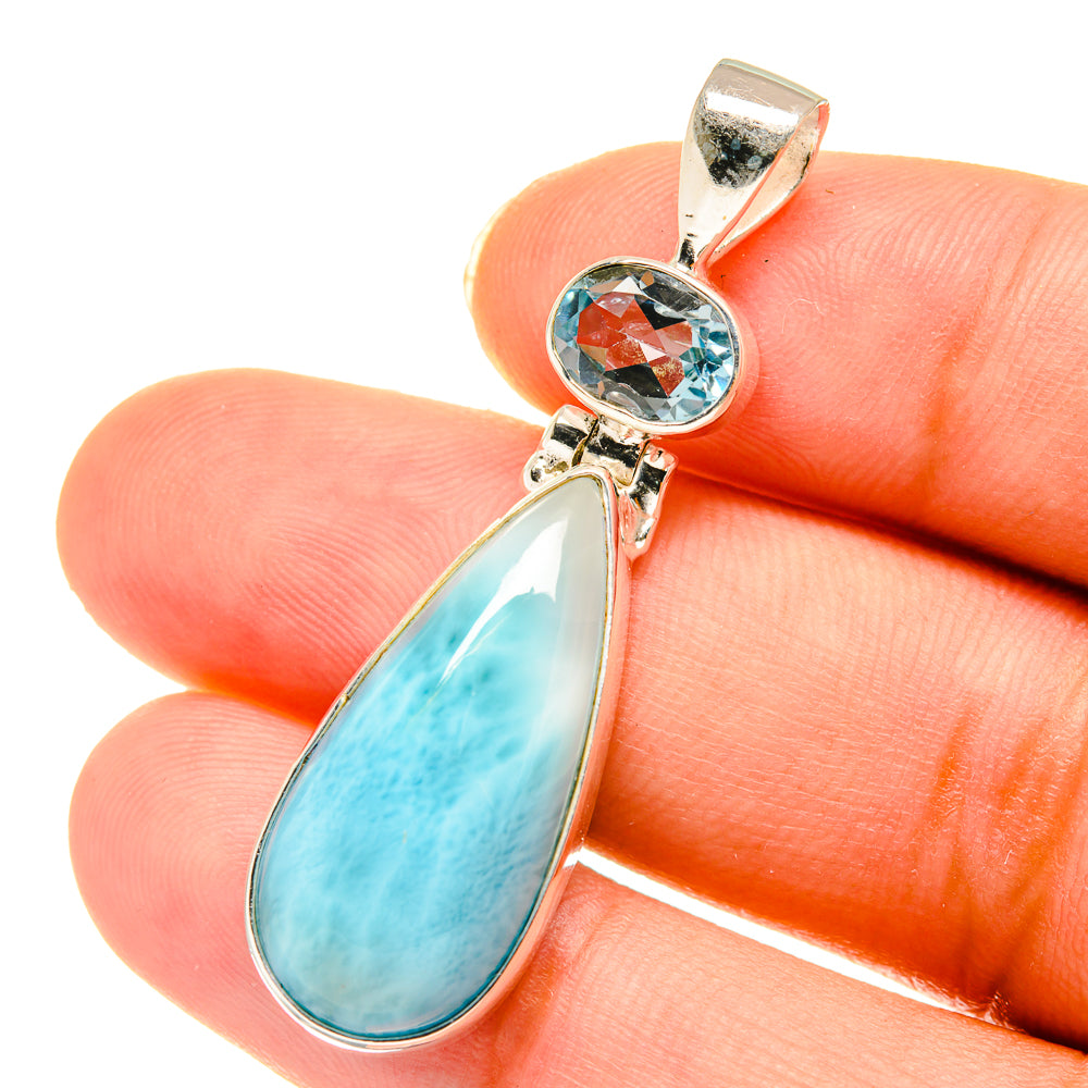 Sterling silver pendant with round blue topaz and large teardrop larimar