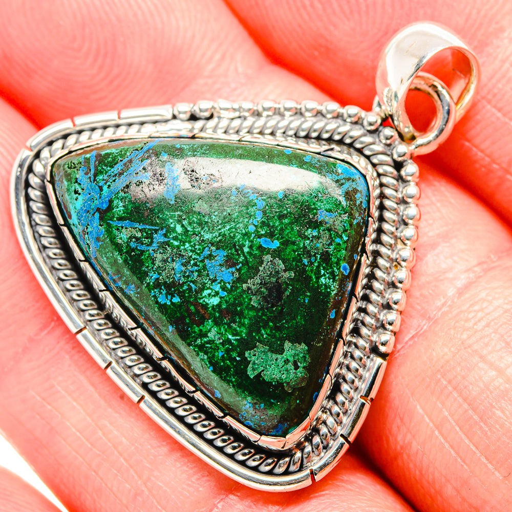 925 sterling silver pendant with triangular green-blue stone and textured rope edging.