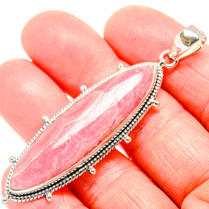 Pink rhodochrosite marquise pendant with sterling silver beaded bezel and side loops
