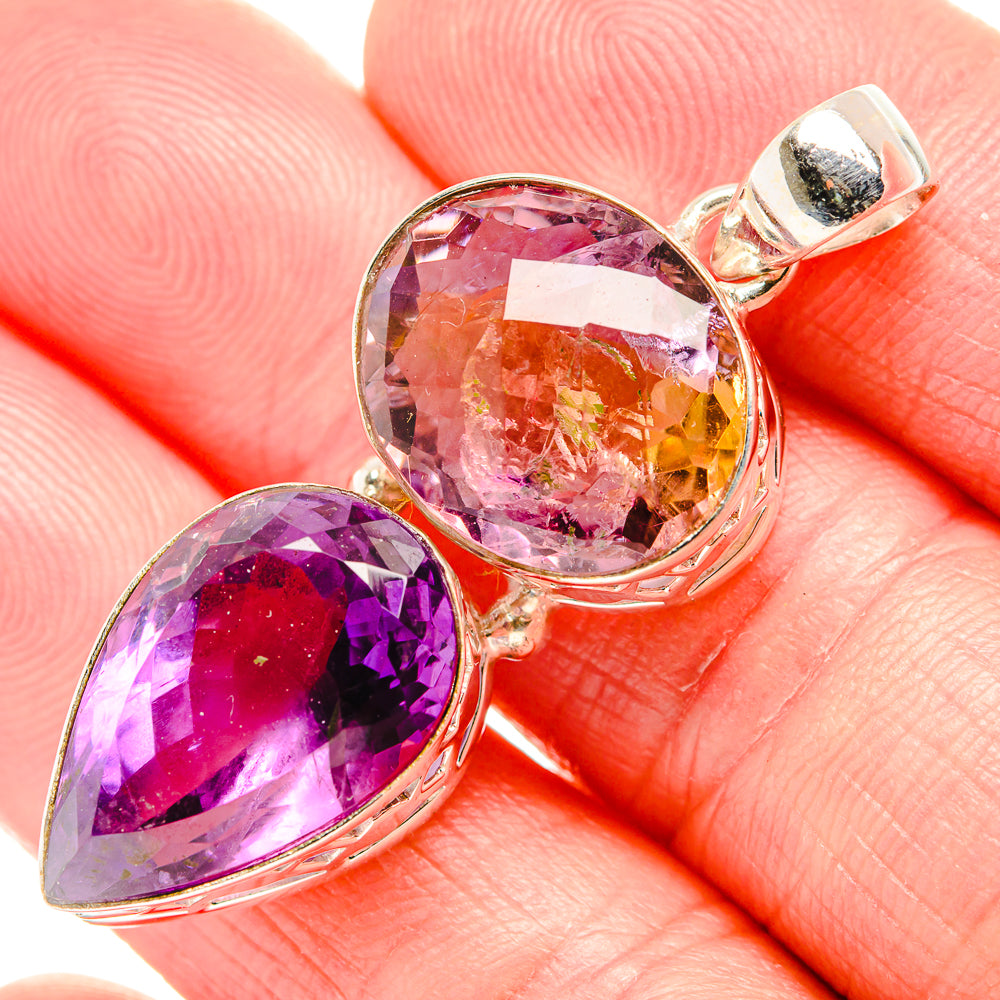Faceted ametrine pendant with large round purple centerpiece, oval purple stone, silver setting