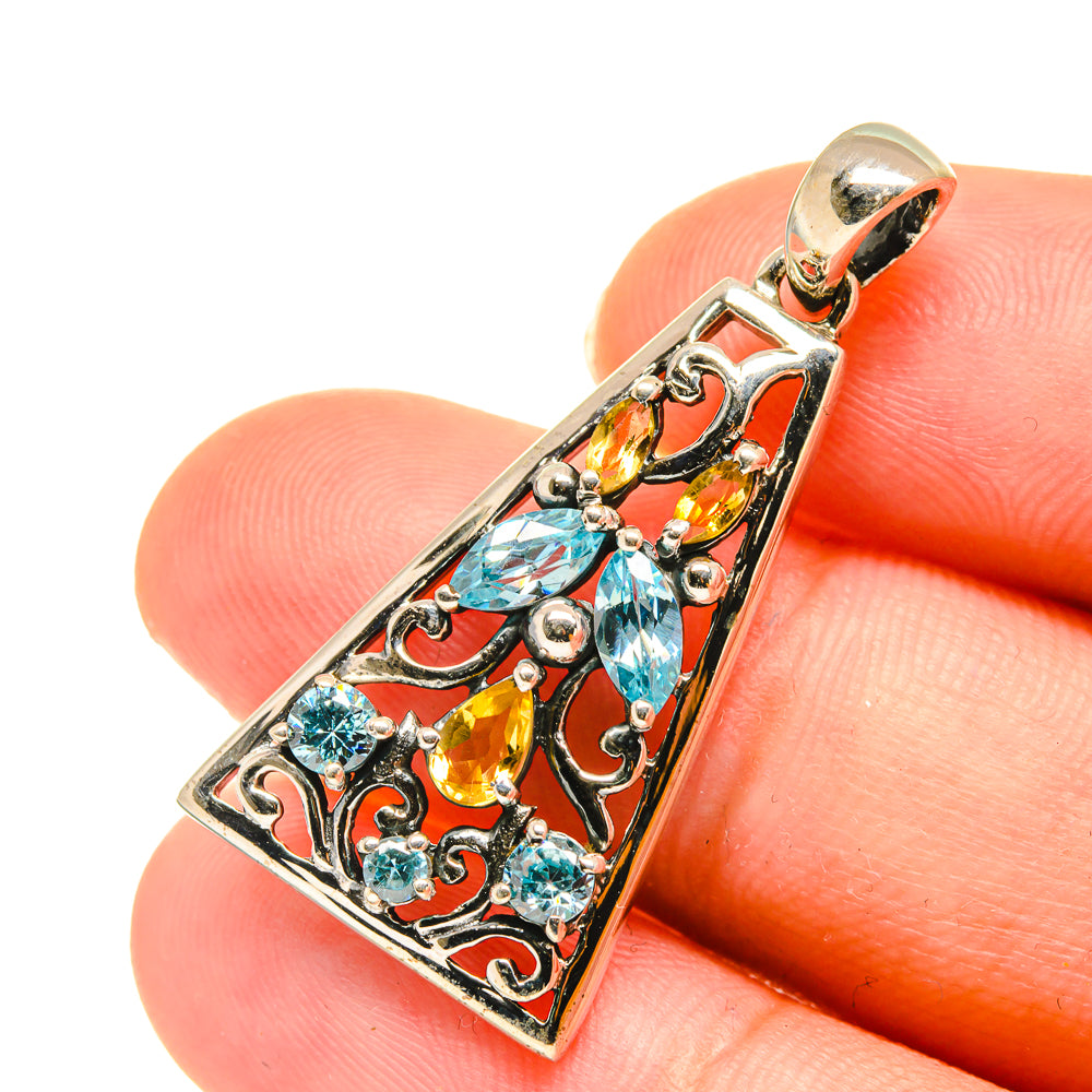 Rectangular gemstone pendant close-up in sterling silver with blue and yellow stones