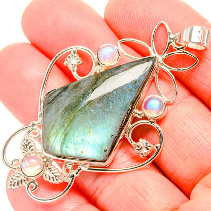 925 sterling silver pendant with faceted blue-green labradorite teardrop and opal accents