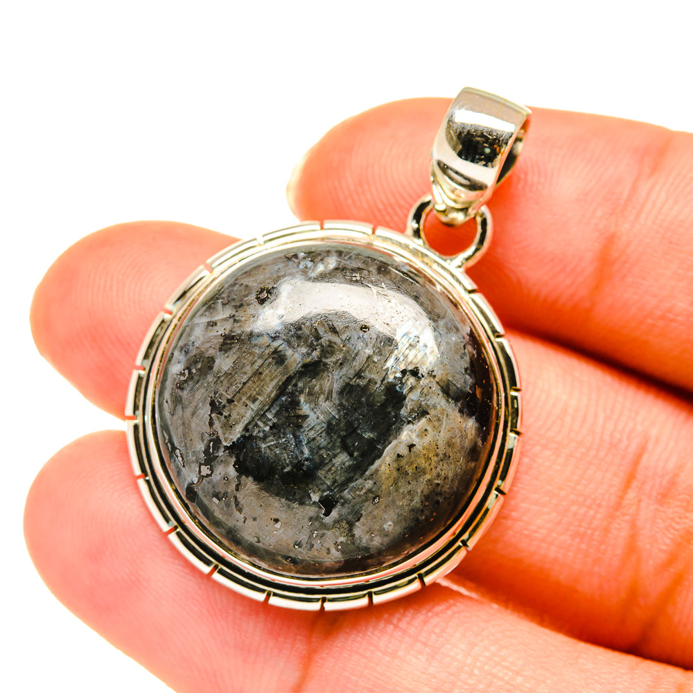 Round gabbro stone pendant with polished bail and sterling silver rope bezel setting.