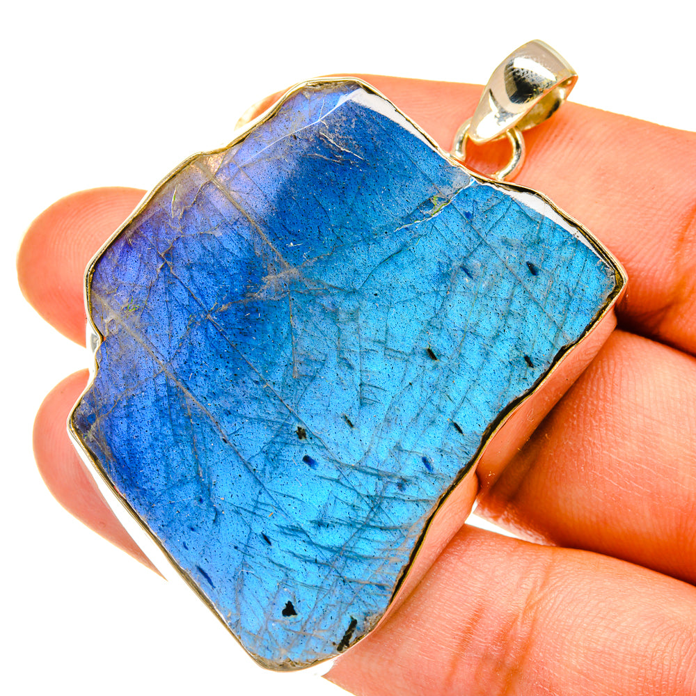 Rough labradorite pendant with bail, vivid blue iridescent stone in gold-tone bezel