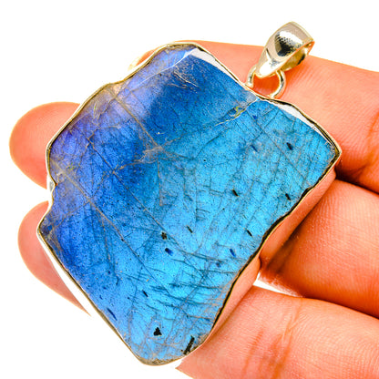 Rough labradorite pendant with bail, vivid blue iridescent stone in gold-tone bezel