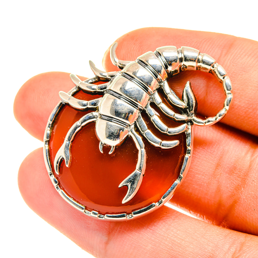 Scorpion pendant in 925 sterling silver with orange-red carnelian cabochon center