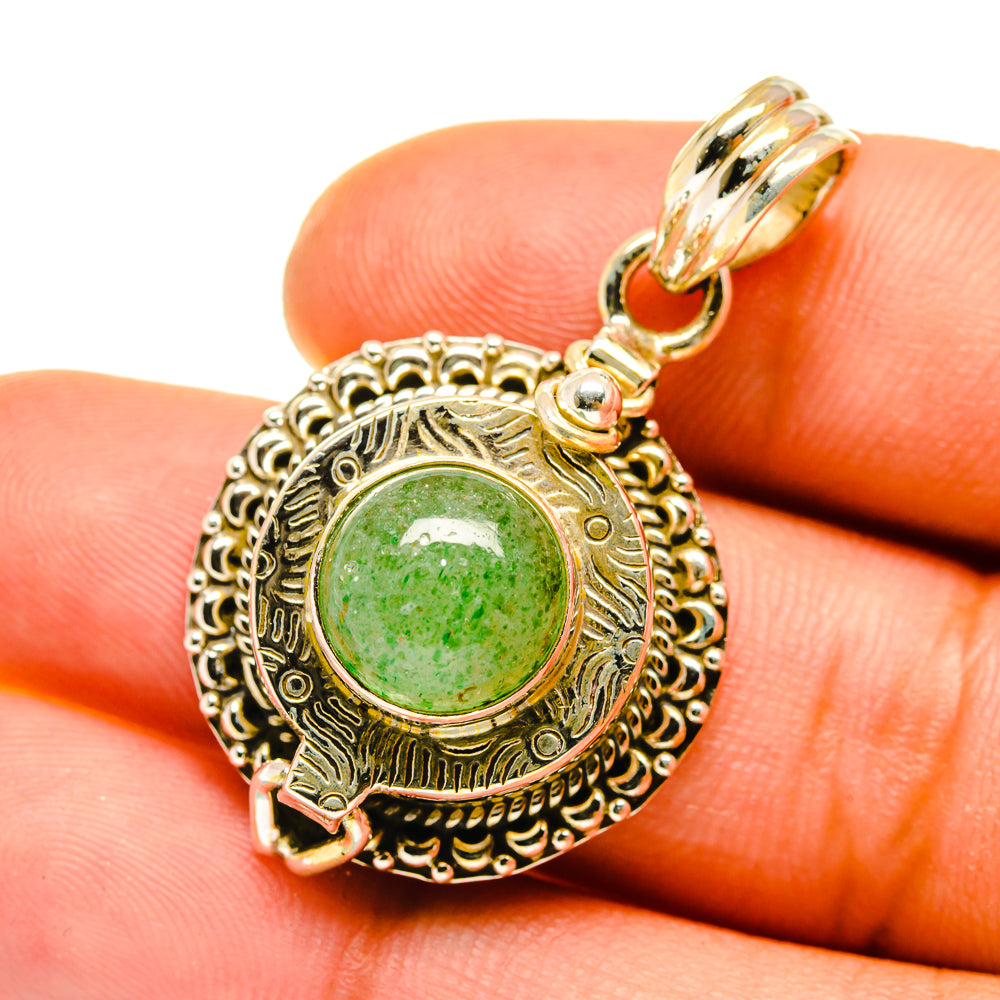 Green aventurine gemstone pendant in ornate gold-toned setting with round bail
