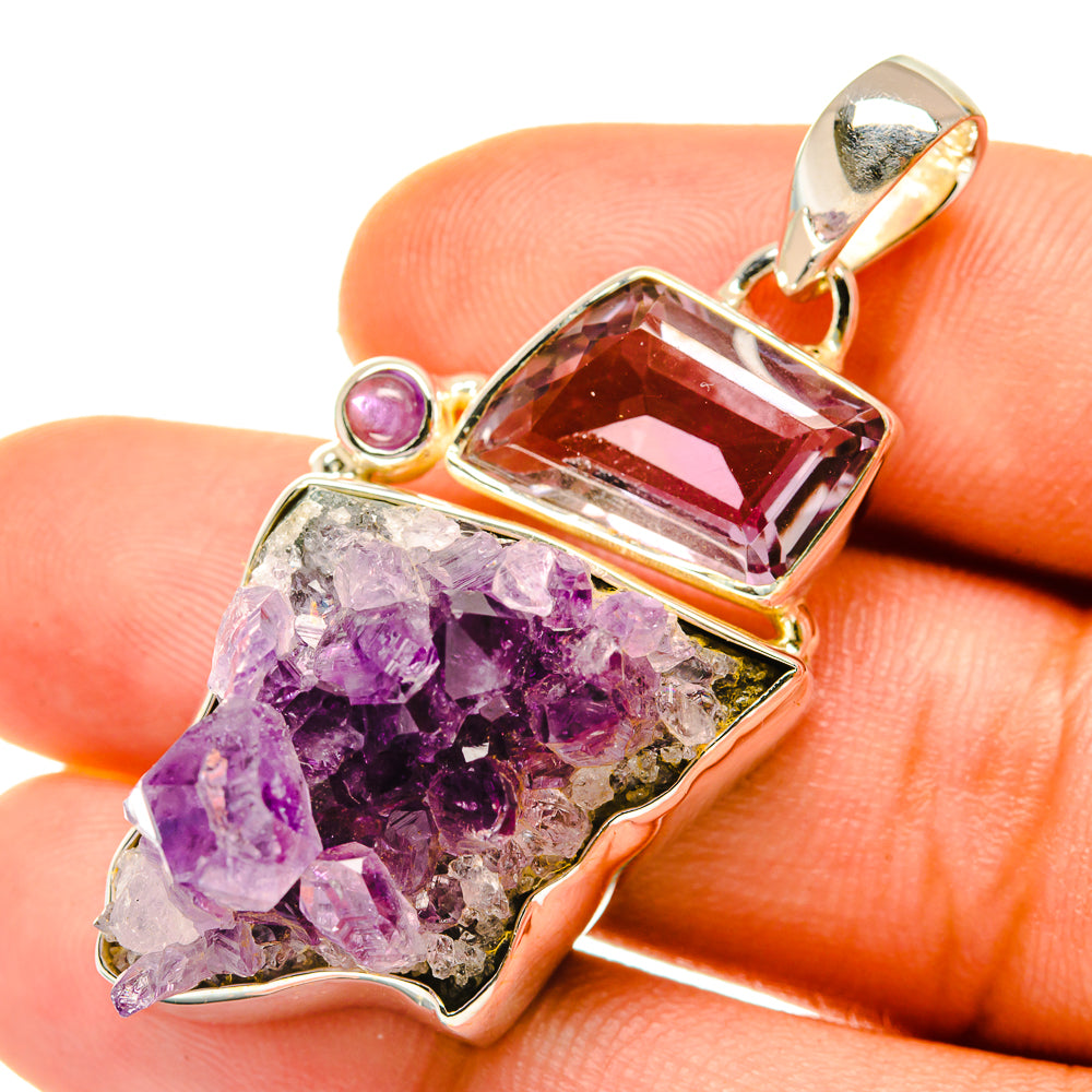 Amethyst crystal sterling silver pendant with purple faceted center stone and crystal cluster